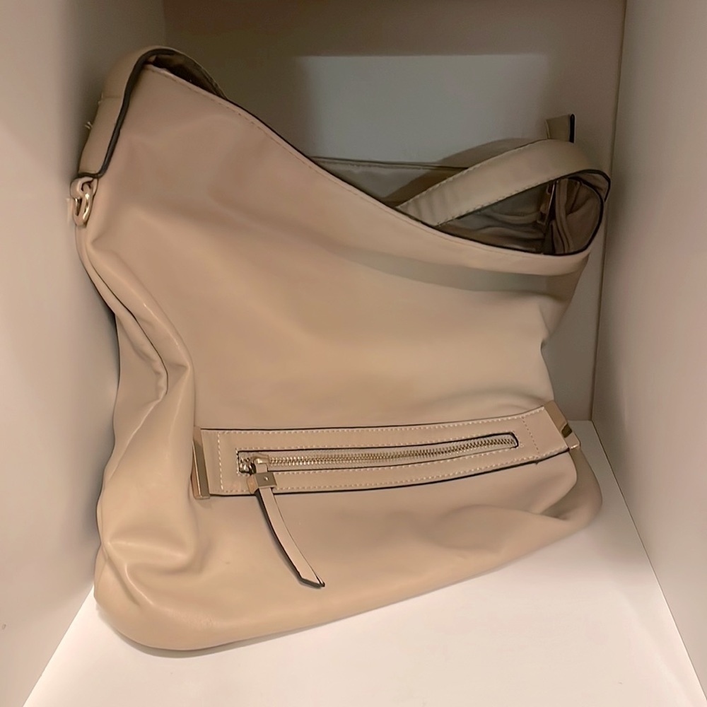 Tan Aldo Hobo Bag with main zippered compartment.